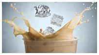 Ice Cubes Splashing in Glass